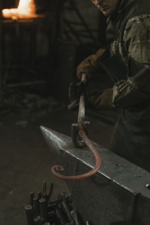 Person Holding Brown Metal Tool · Free Stock Photo
