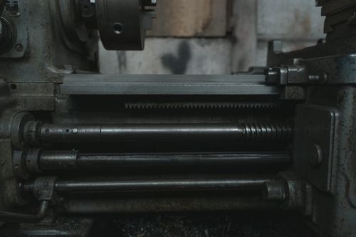 Free Close-up of a lathe machine highlighting metalwork details in a workshop. Stock Photo