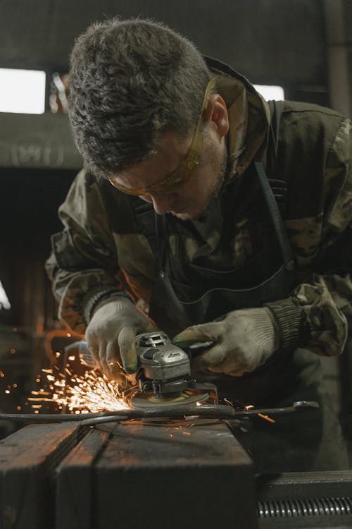Free Close-Up Shot of a Man Doing a Metalwork Stock Photo
