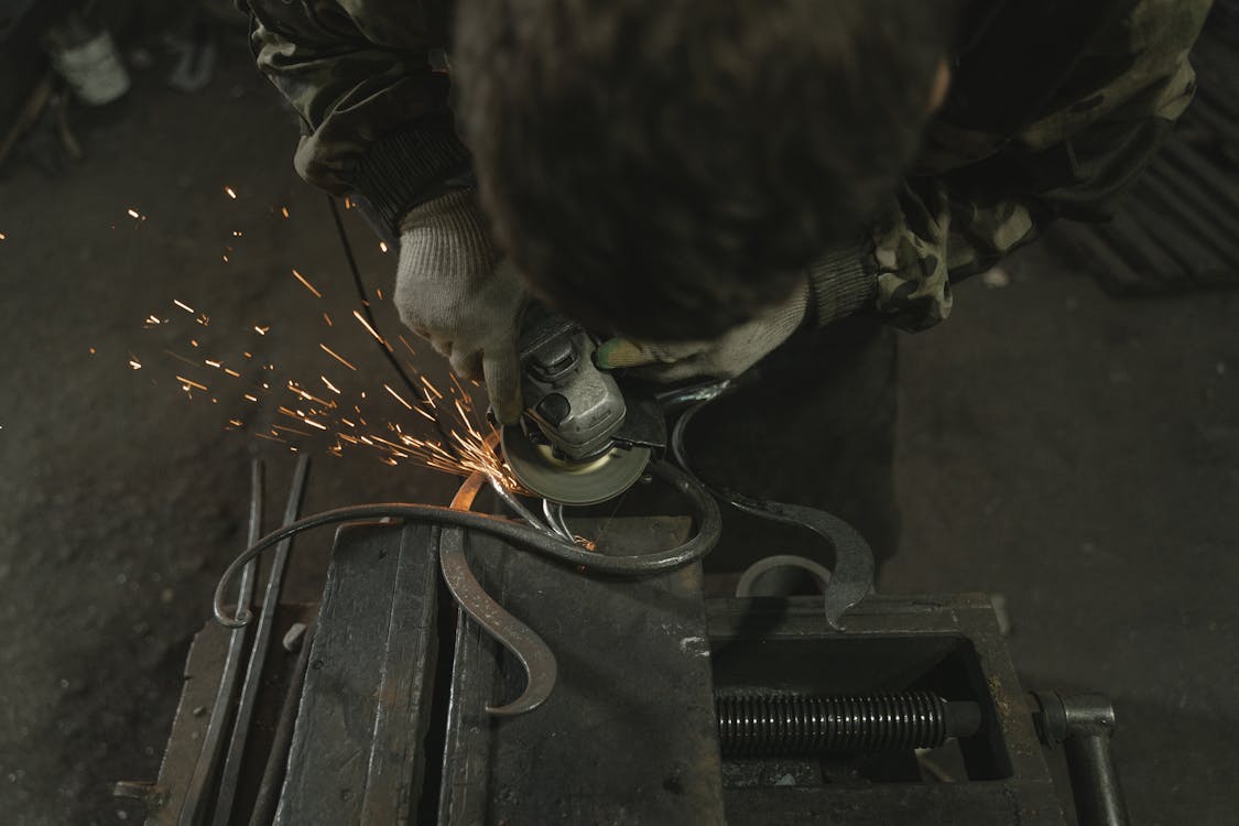 A Man Using an Angle Grinder
