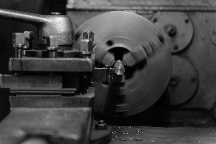 Grayscale Photo Of A Lathe Machine