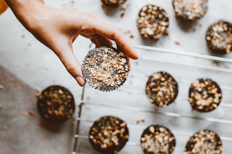 Hand Holding Cupcake With Sprinkles