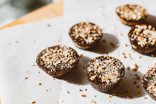 Close-up shot of chocolate cupcakes topped with almonds, perfect for food photography and indulgent treats.