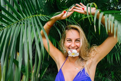 Free Woman in Blue Bikini Top Holding Green Leaf Stock Photo