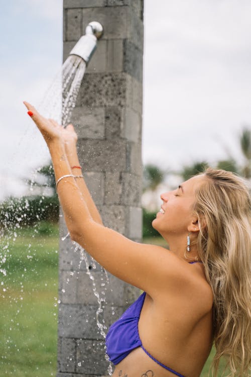 Free Girl in Blue bikini Taking a Shower Stock Photo