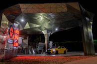 Cars Parked in Front of Building during Night Time