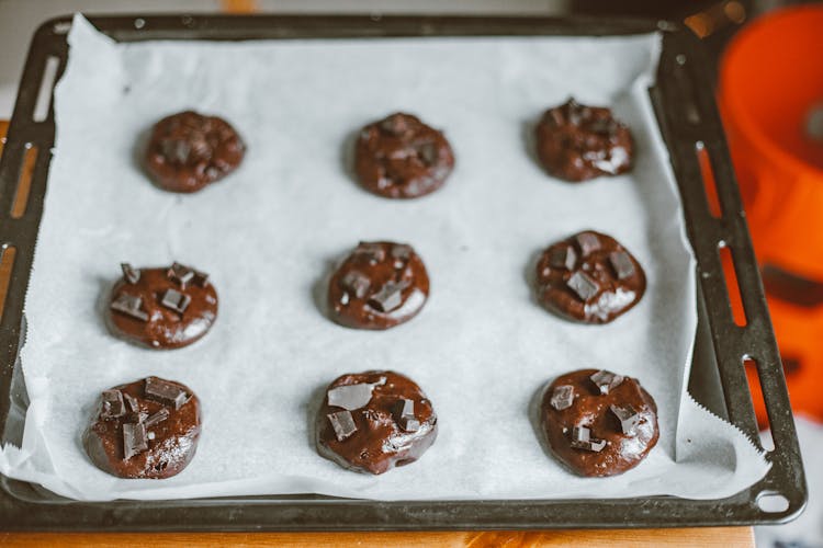 Raw Chocolate Chip Cookies On A Baking Tray 