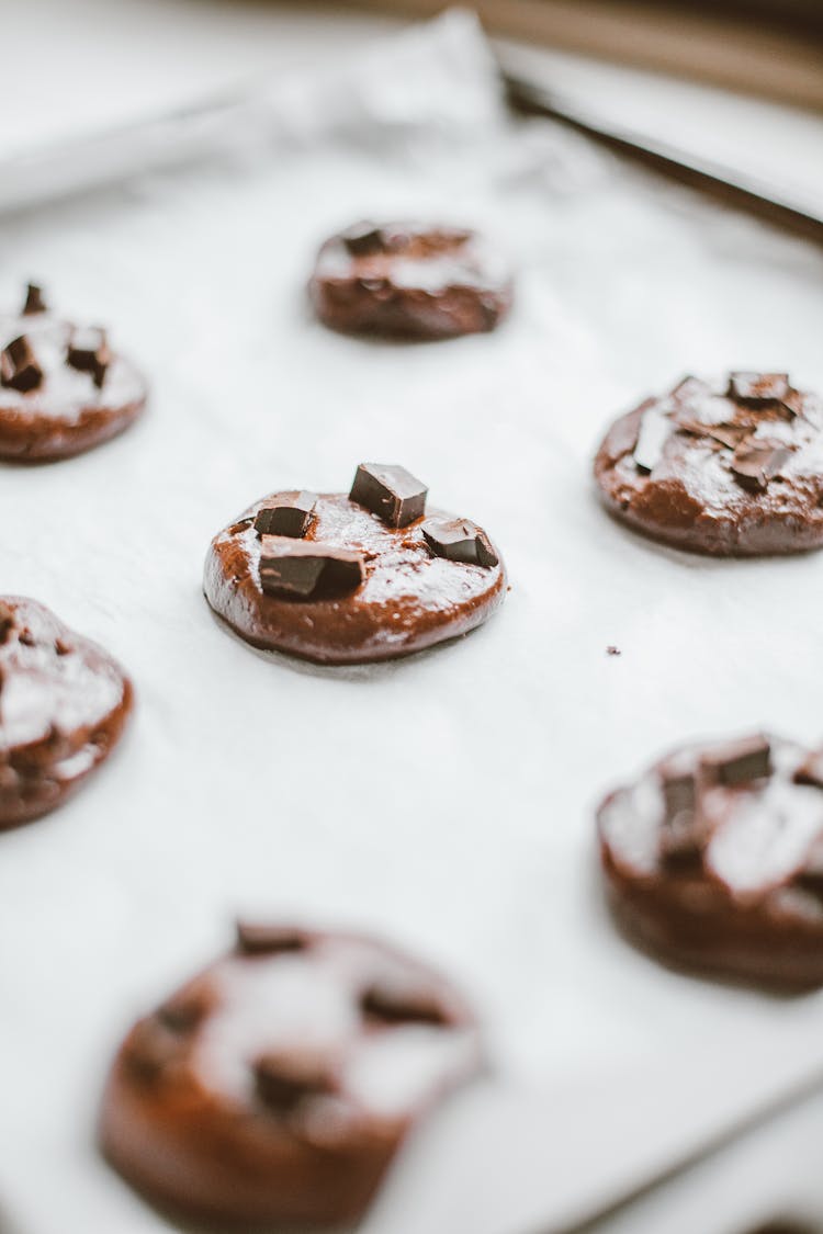 Raw Chocolate Cookies On A Baking Tray