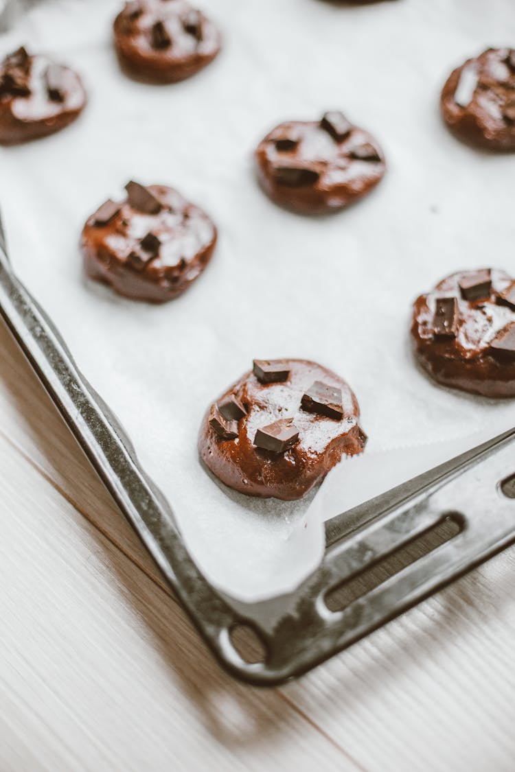 Raw Chocolate Cookies On A Baking Tray