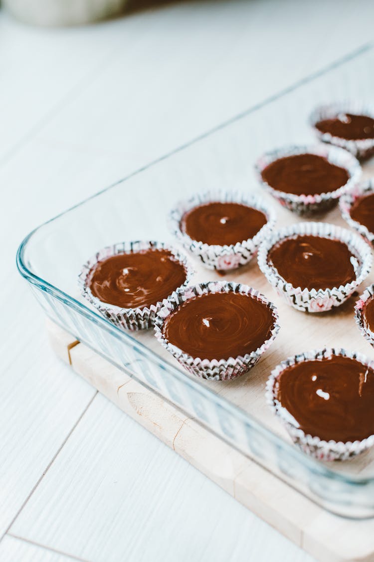 Cupcakes With Chocolate Icing In Glass Tray