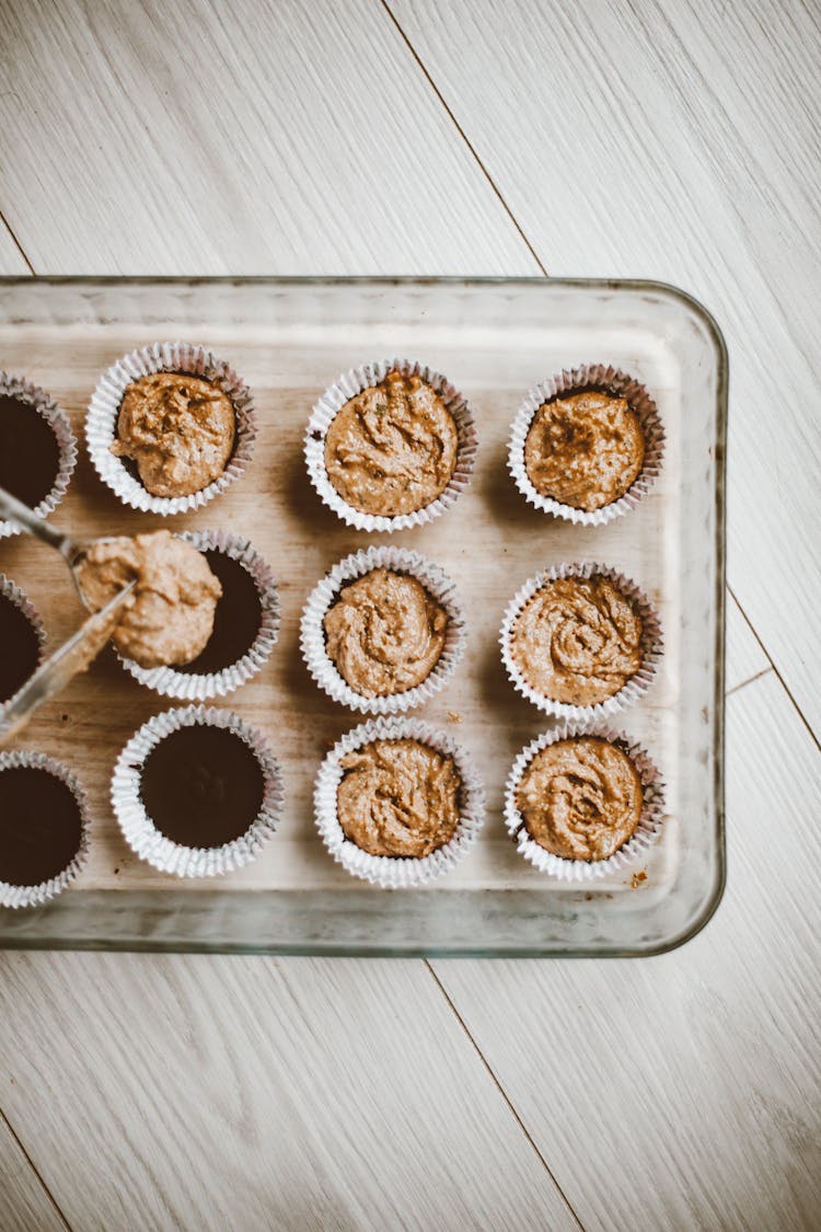 Putting Cupcake Batter Into Paper Moulds