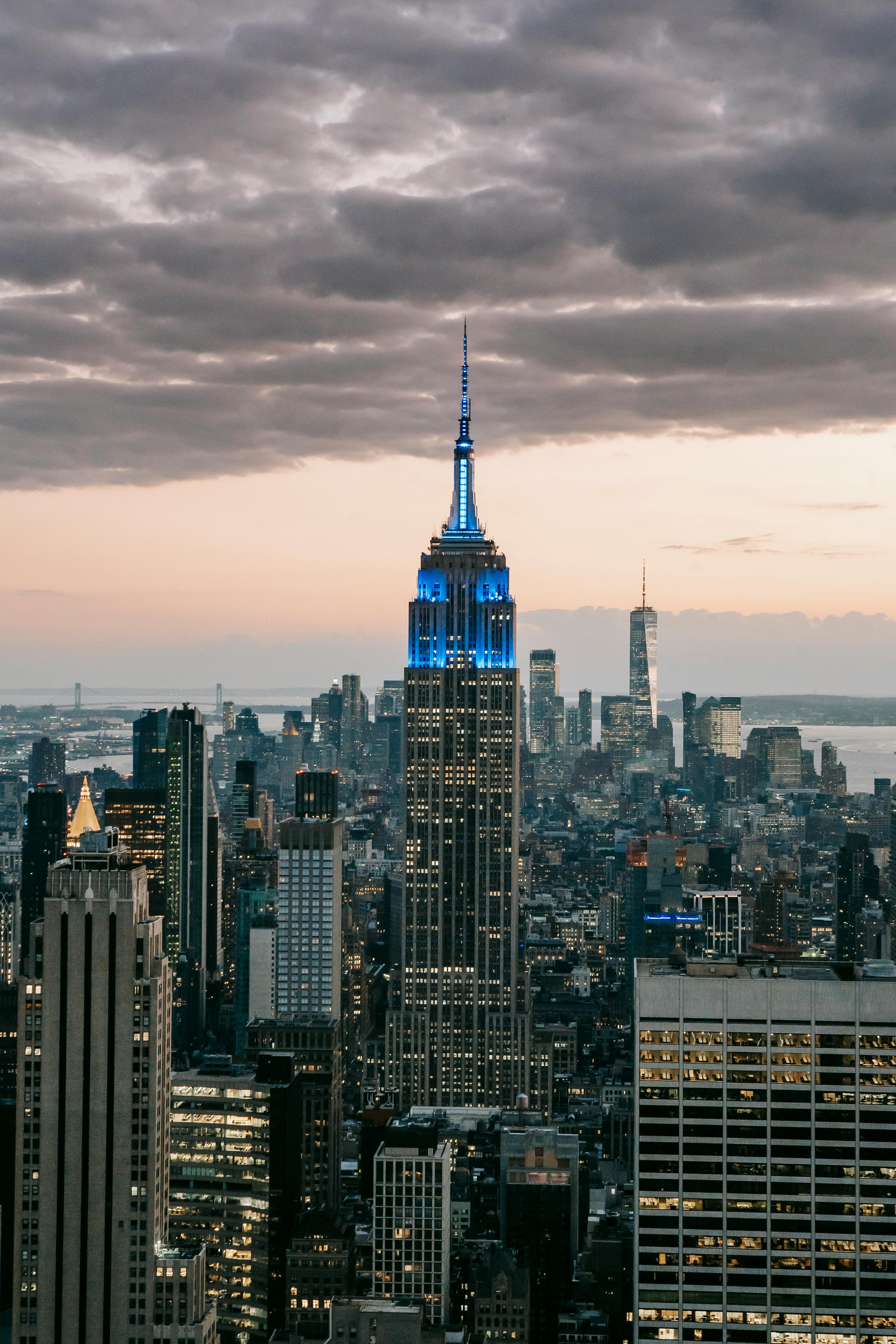 empire state building under cloudy sky in city