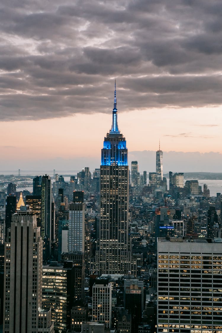 Empire State Building Under Cloudy Sky In City