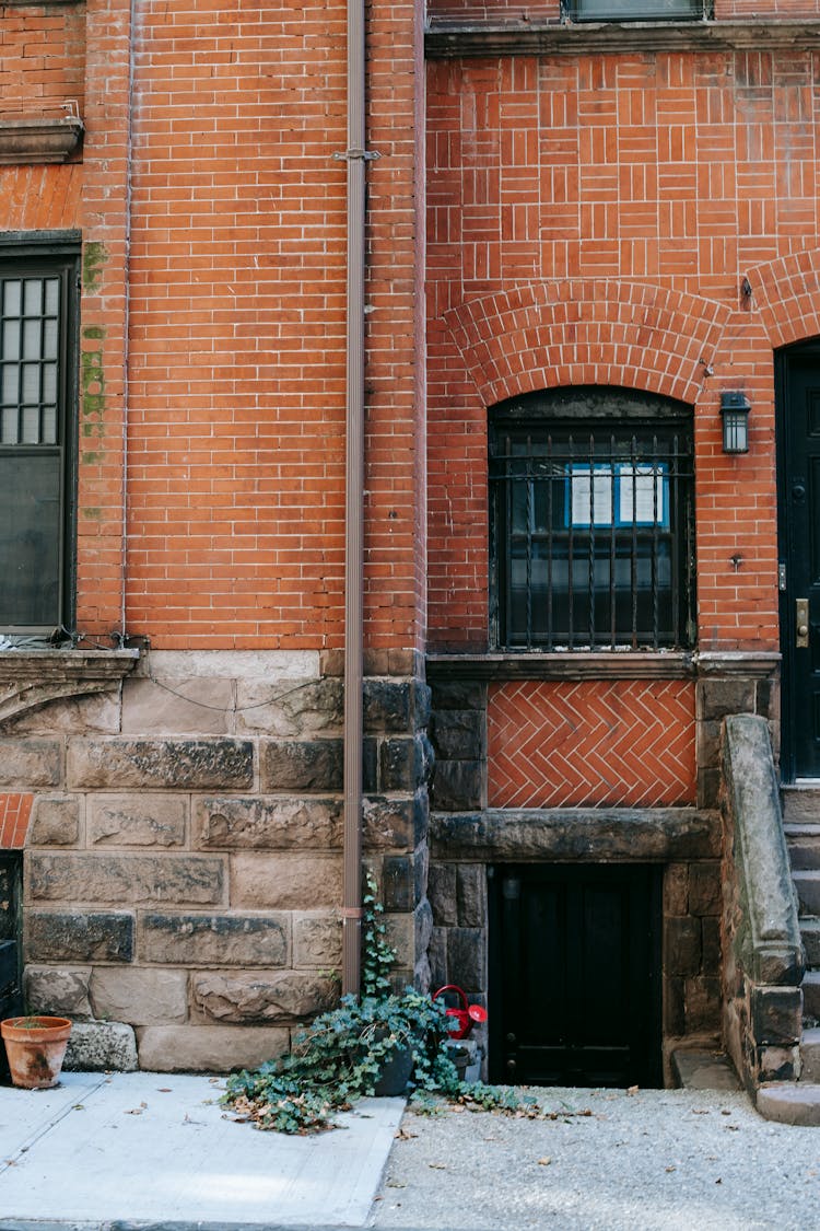 Weathered Brick Residential Building On City Street