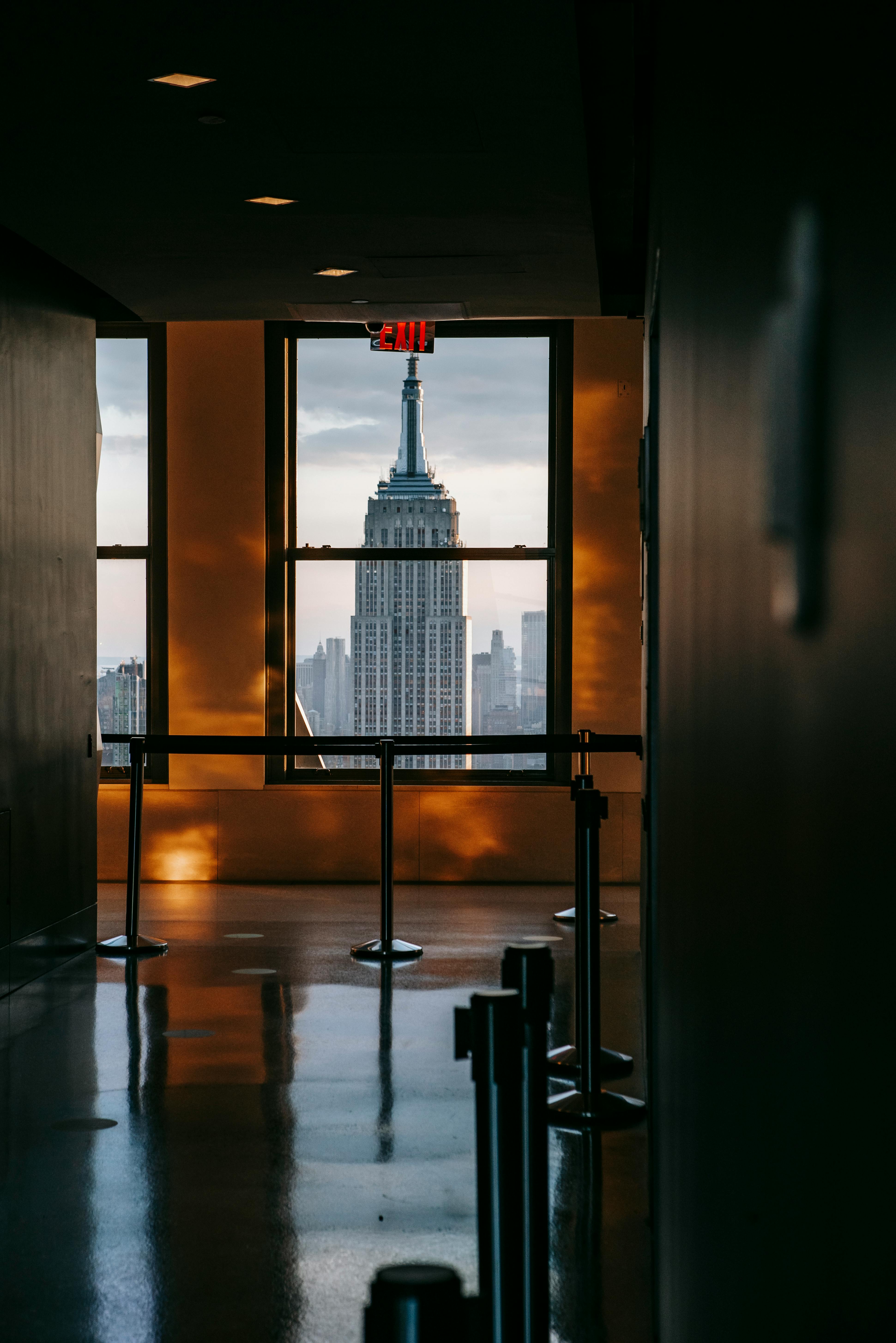 corridor with windows overlooking modern city with skyscrapers