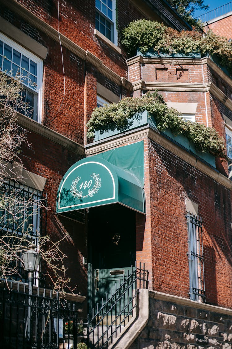 Corner Of Stylish Old Brick Residential Building On Sunny Day