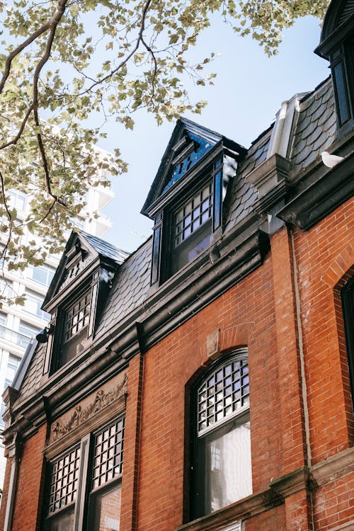 Brown Brick Building With Glass Windows