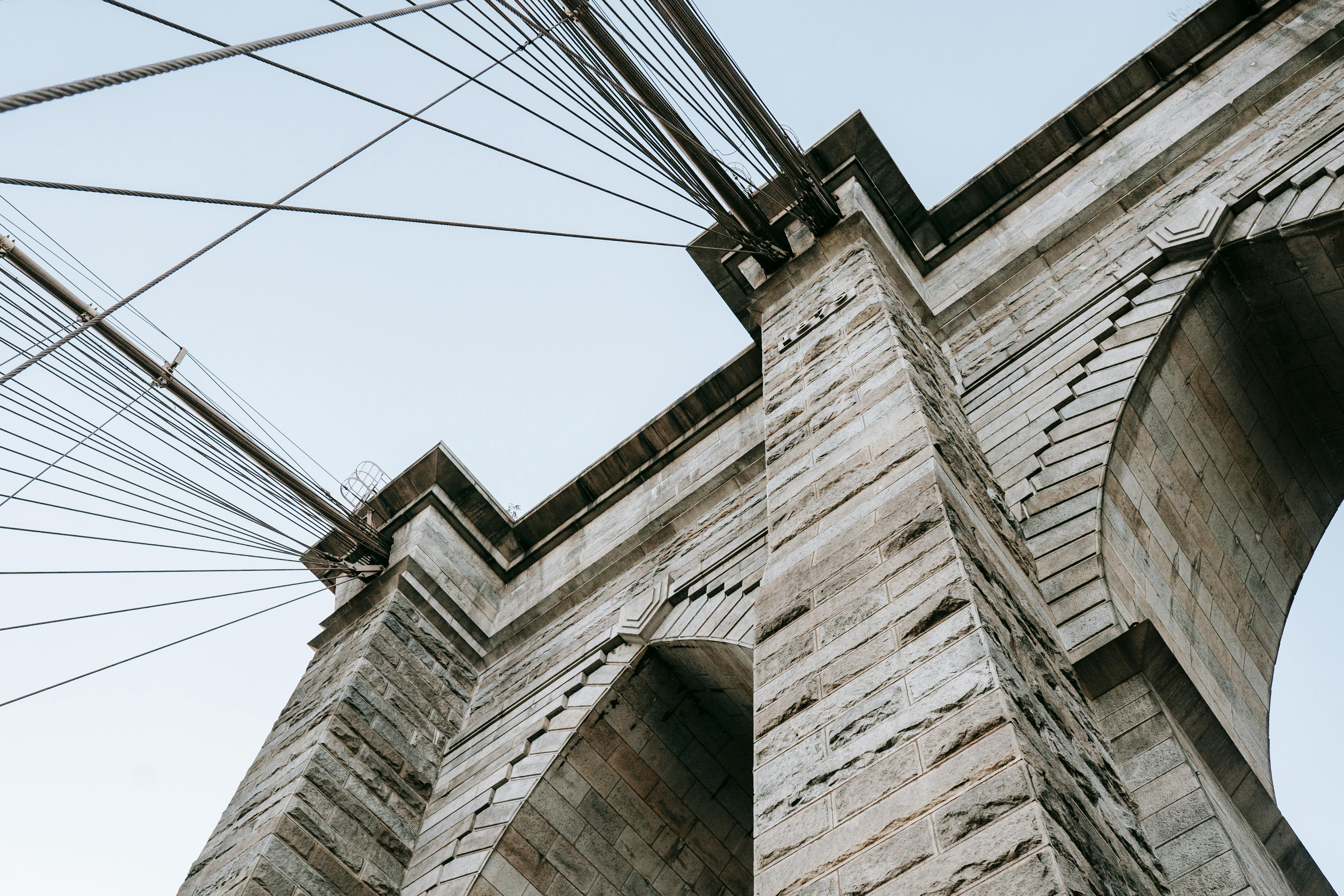 huge stone arches on suspension bridge