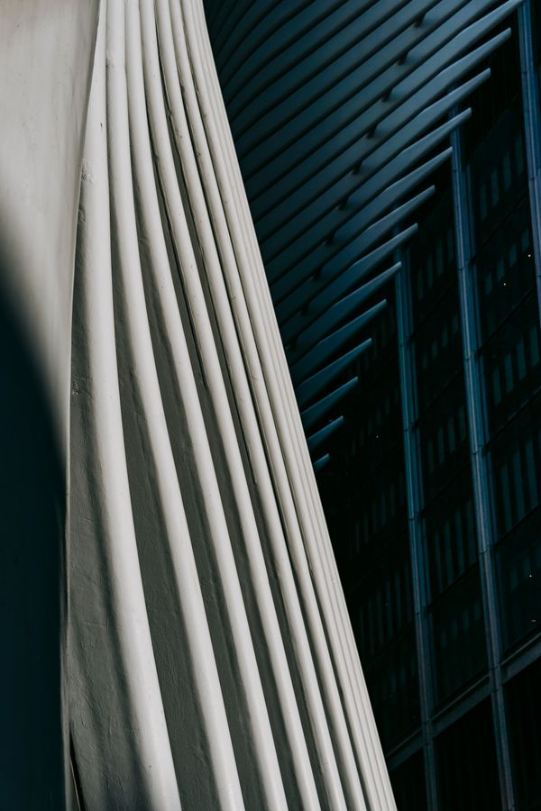 Close-up of a ribbed concrete facade in warm light