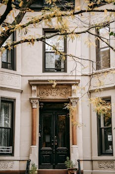 A classic urban building exterior with ornate columns and decorative facade details.