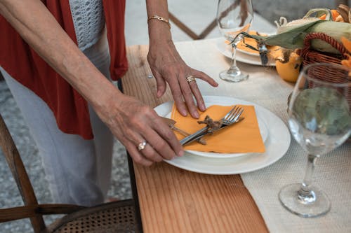 Free Woman Setting the Table Stock Photo