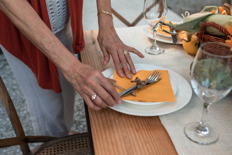 Woman Setting The Table