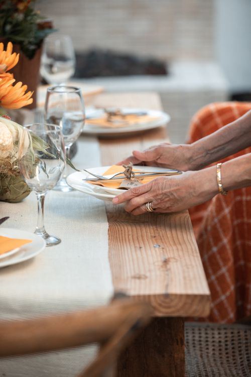Free A beautifully set table in warm autumn colors perfect for a Thanksgiving celebration. Stock Photo