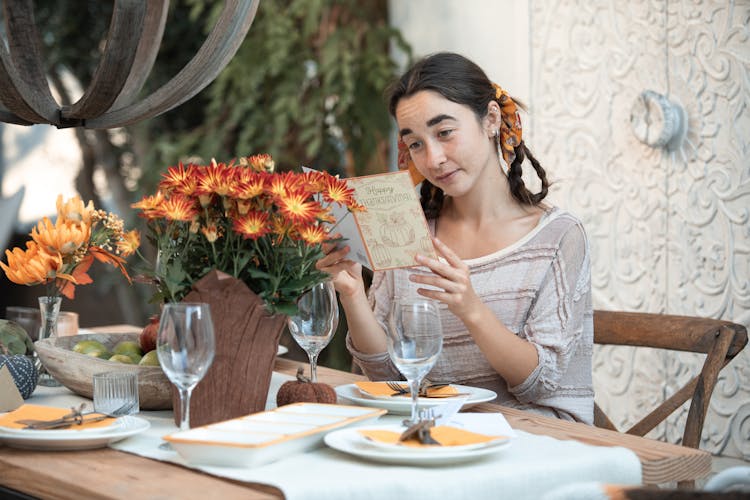 Woman Reading A Thanksgiving Card