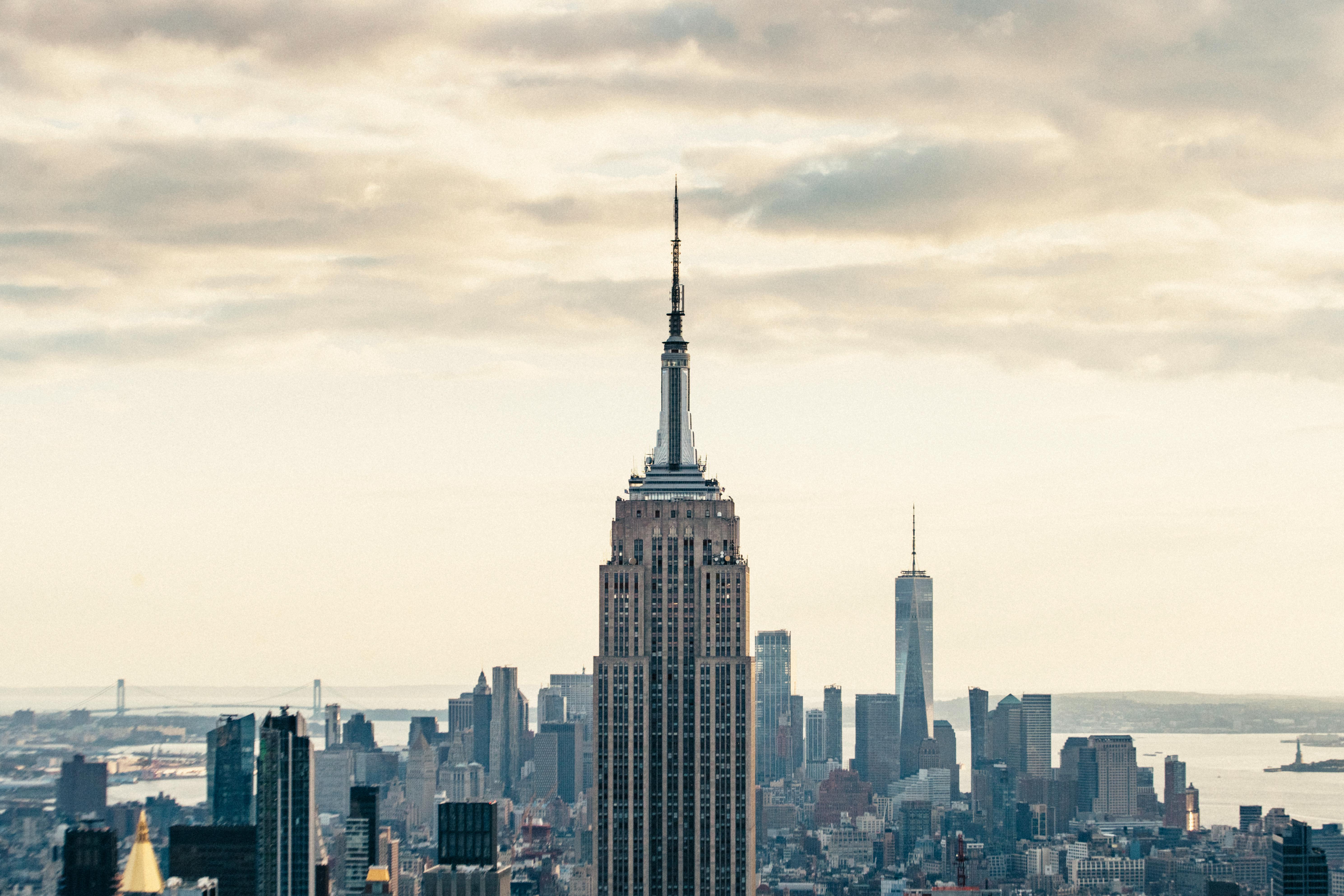 high rise buildings in modern megapolis under cloudy sky