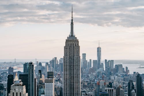 Cityscape of downtown with modern high rise buildings under cloudy sky in New York