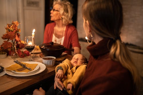 Free Family Sitting at the Table during Thanksgiving  Stock Photo