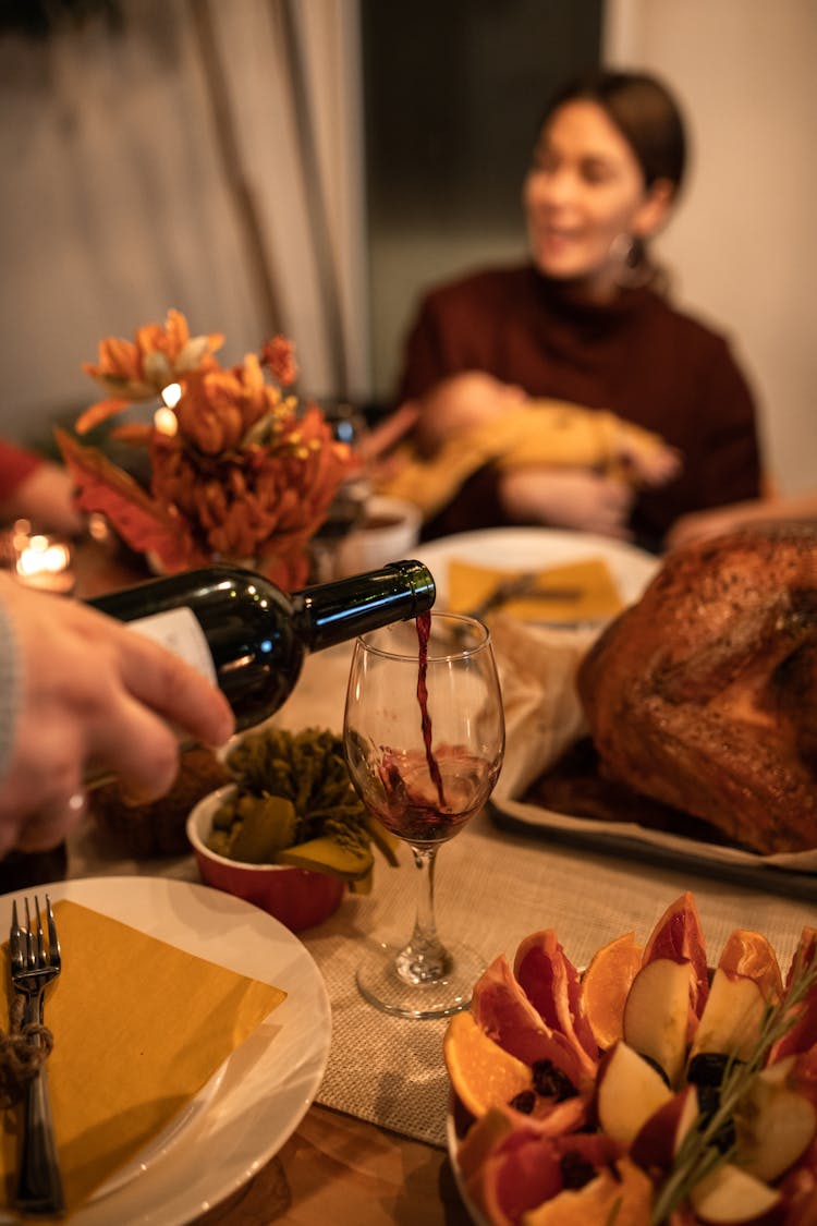 Pouring Wine On Glass 