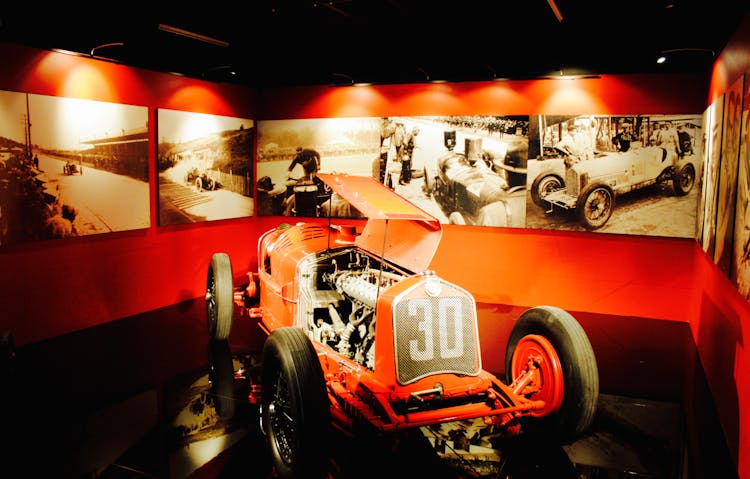 Red Vintage Car Parked Inside A Museum