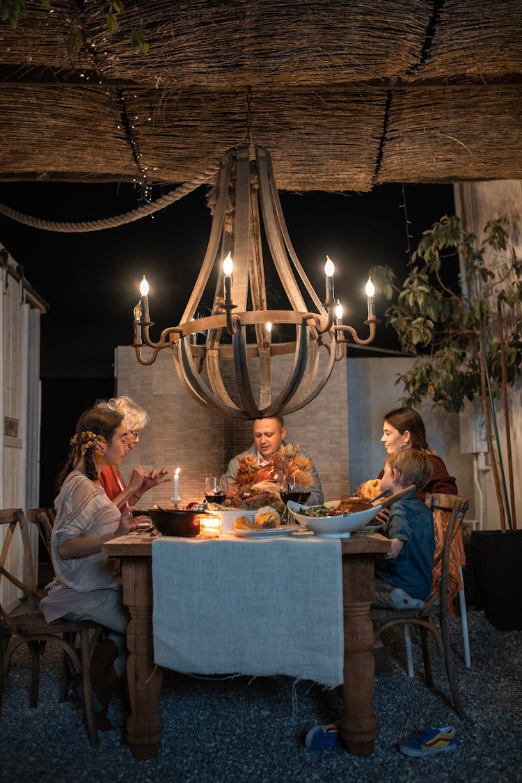 A Family Having Dinner Together 