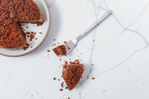 Free Slice of Pecan Cake on Marble Surface Stock Photo