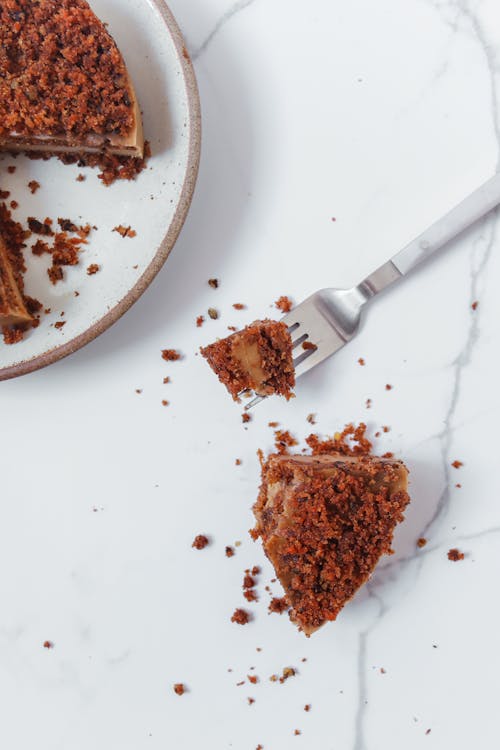 Free Slice of Pecan Cake on Marble Surface Stock Photo