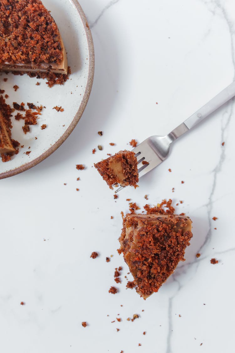 Slice Of Pecan Cake On Marble Surface