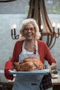 Woman Holding Roasted Turkey