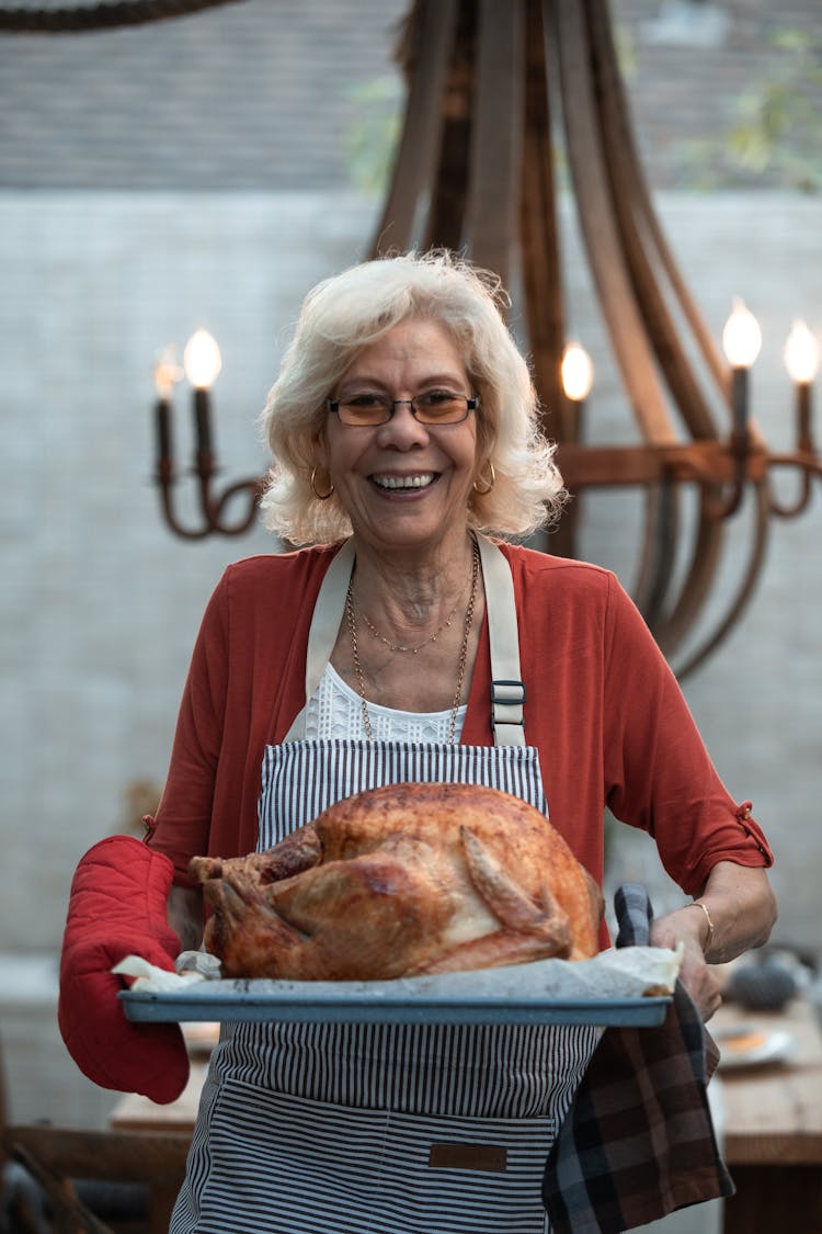 Woman Holding Roasted Turkey