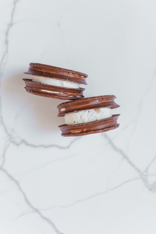 Free Chocolate Cookies on White Marble Surface Stock Photo