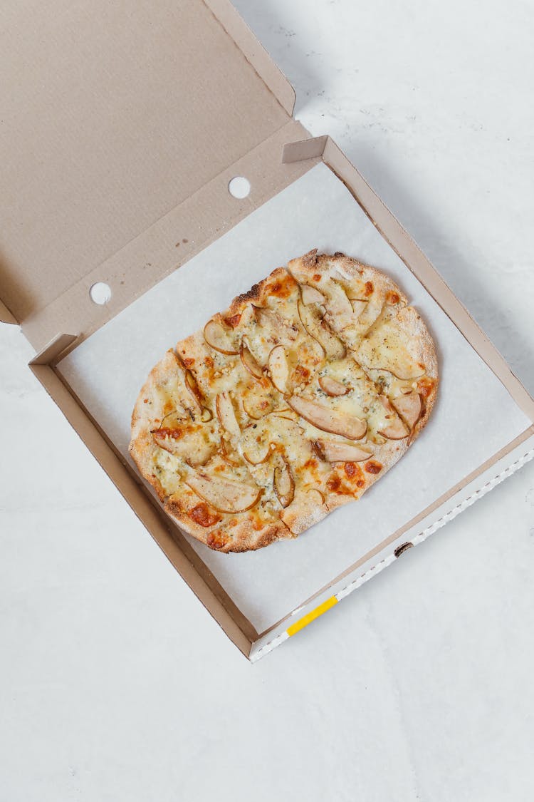 Flatlay Of A Pizza In The Box