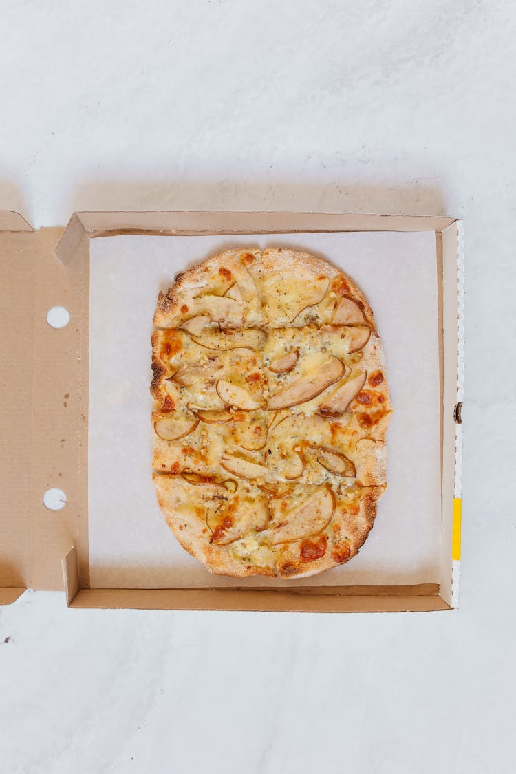 Flatlay Of A Pizza In The Box