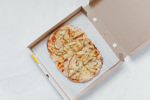 Top View of a Pizza on Brown Box