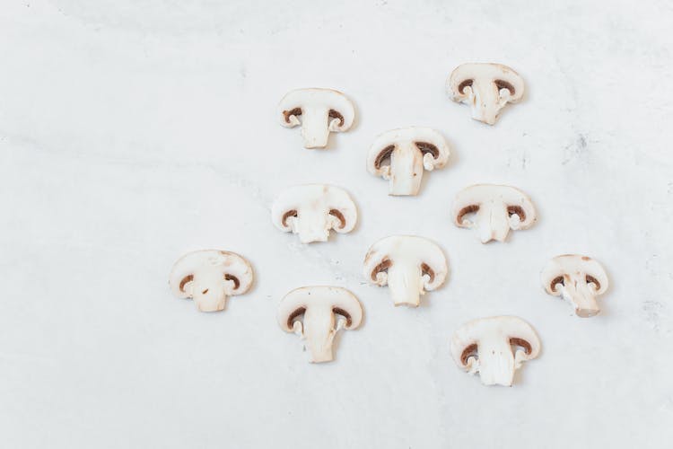 Sliced Mushrooms On White Surface