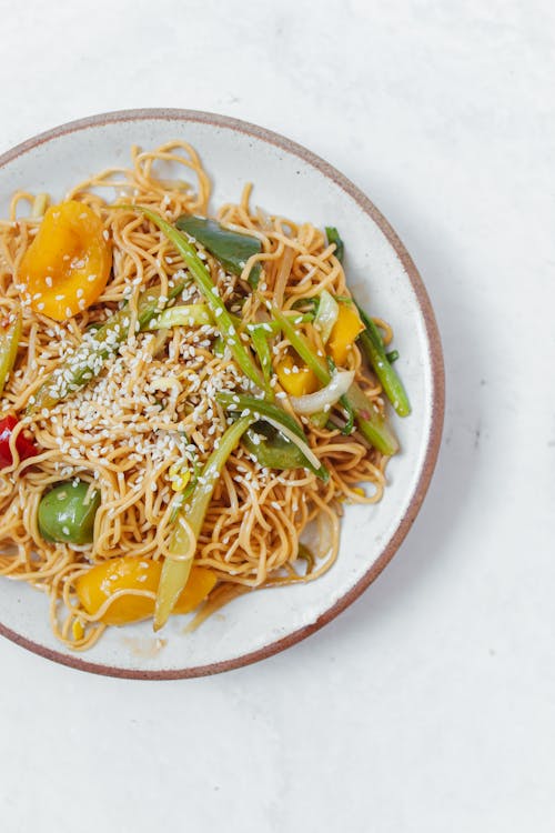 Stir Fry Noodles and Vegetables on a Ceramic Plate