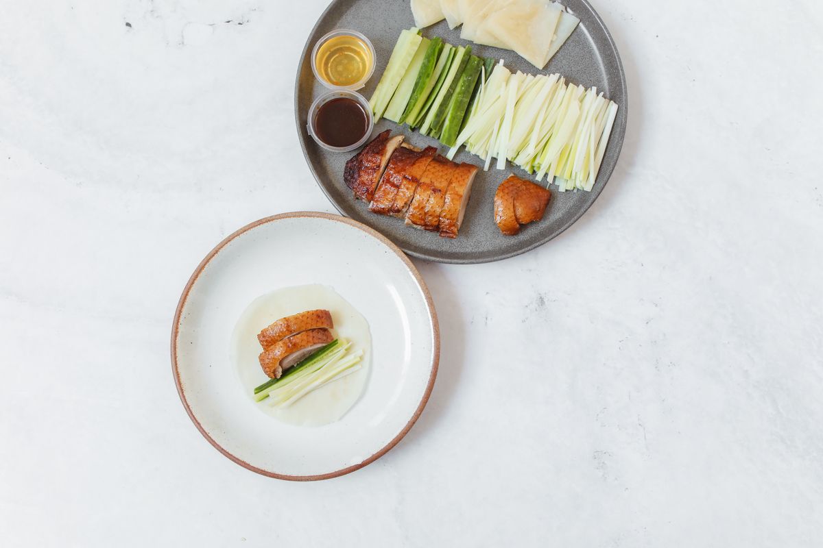 Sliced Peking duck served with cucumber, scallions and thin pancakes, Beijing's signature dish