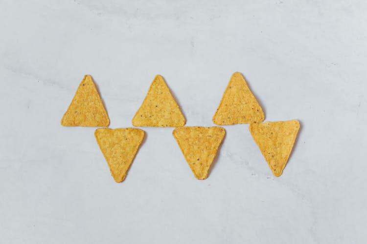 Tortilla Chips Arrangement Against White Background