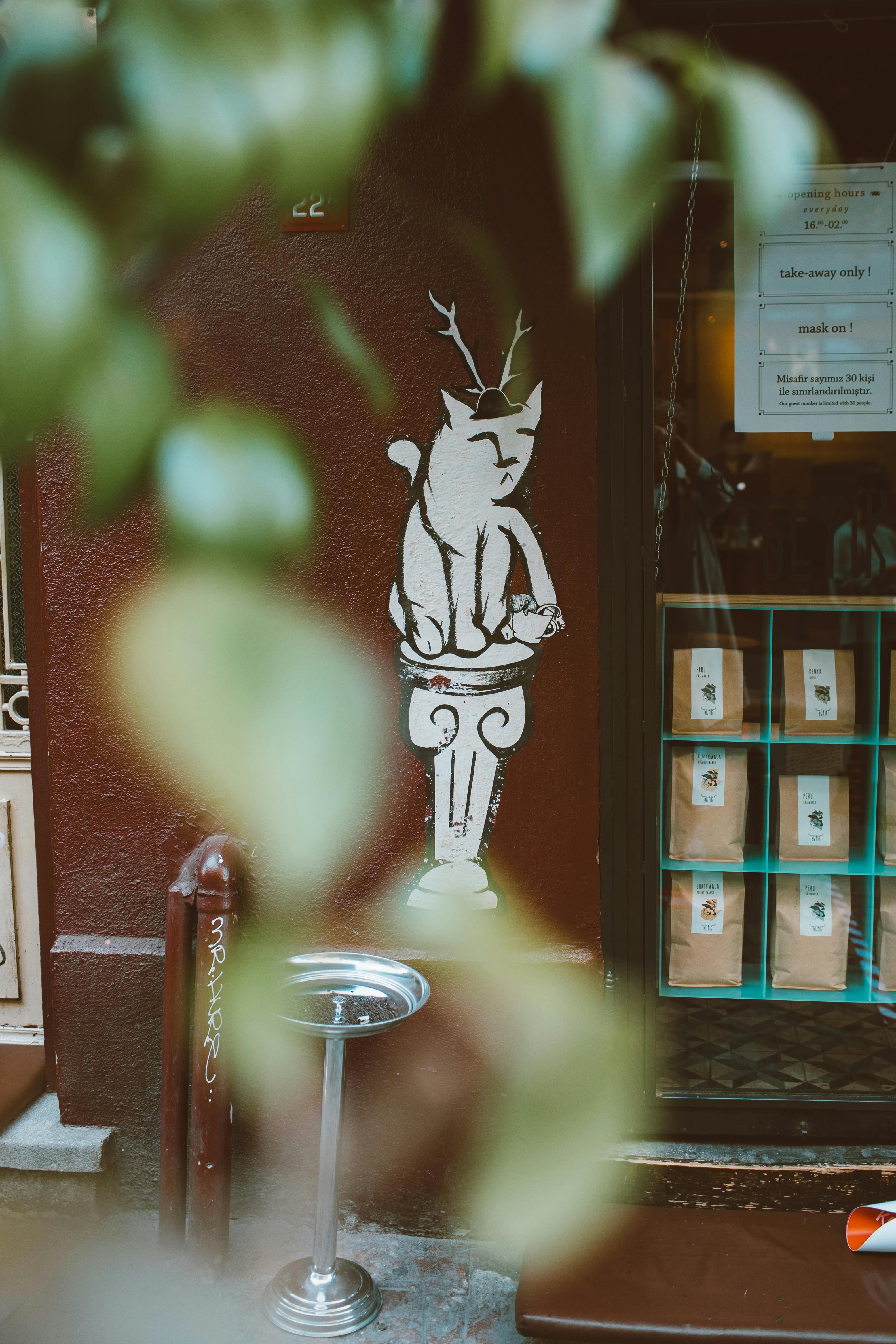 Free An artistic mural depicting a whimsical creature on a street wall, creating urban charm. Stock Photo