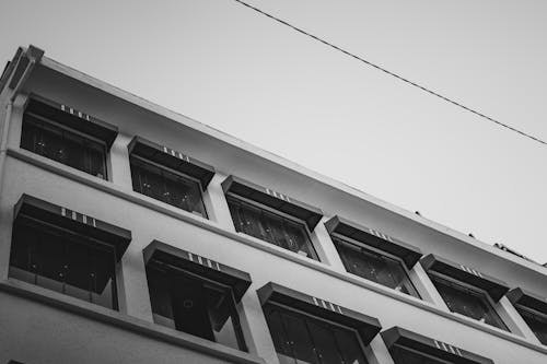 Grayscale Photo of Concrete Building