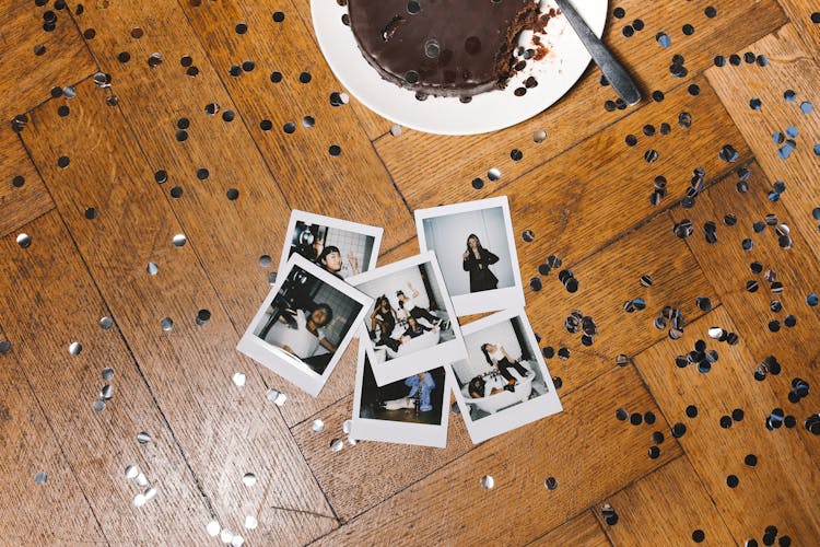 Polaroid Photos And Confetti On The Floor